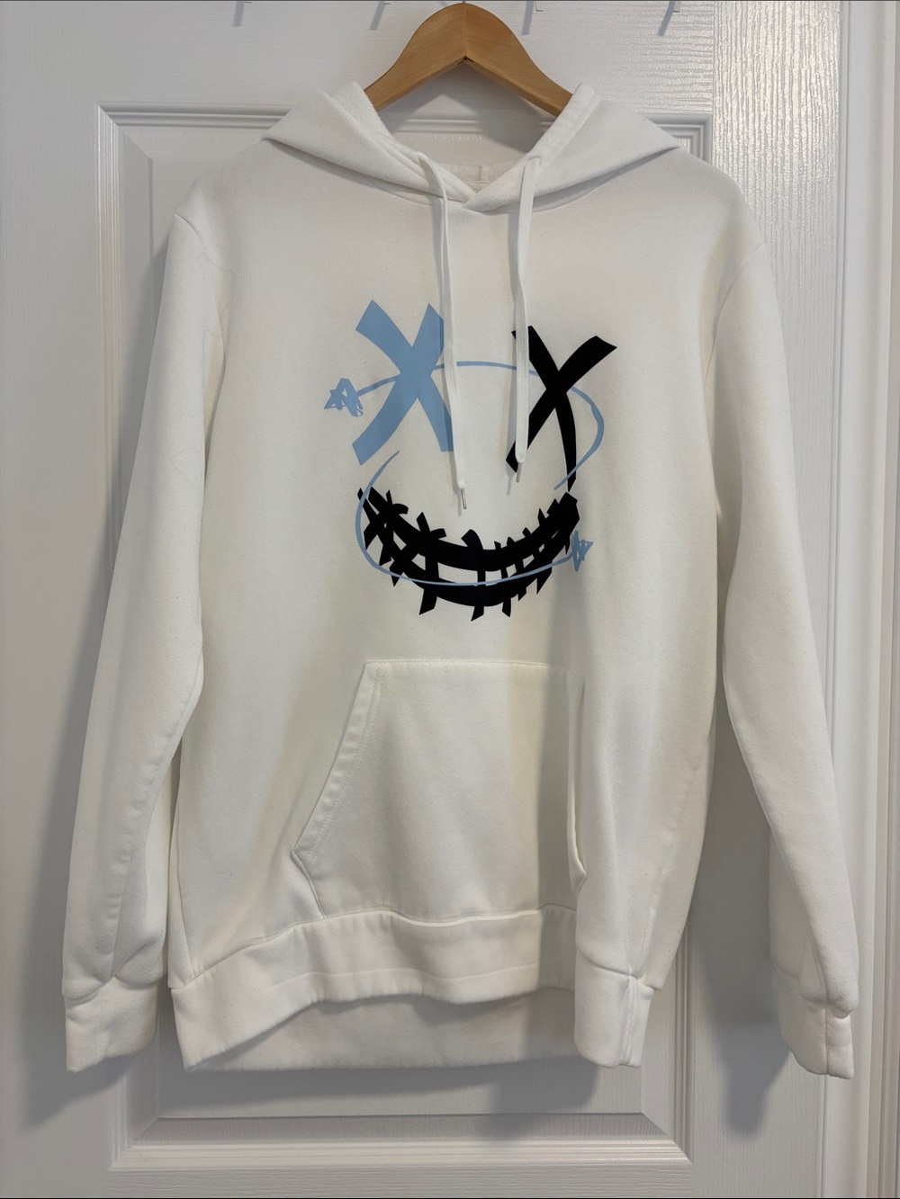 White Graphic Hoodie Sweatshirt with Blue and Black Smiley Design